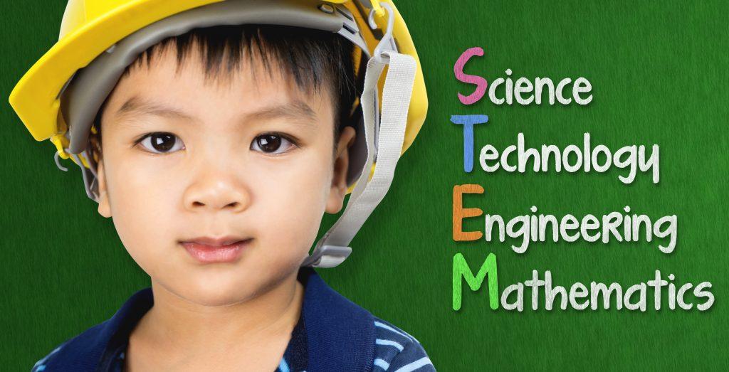 Engineer boy is studying STEM education on black board