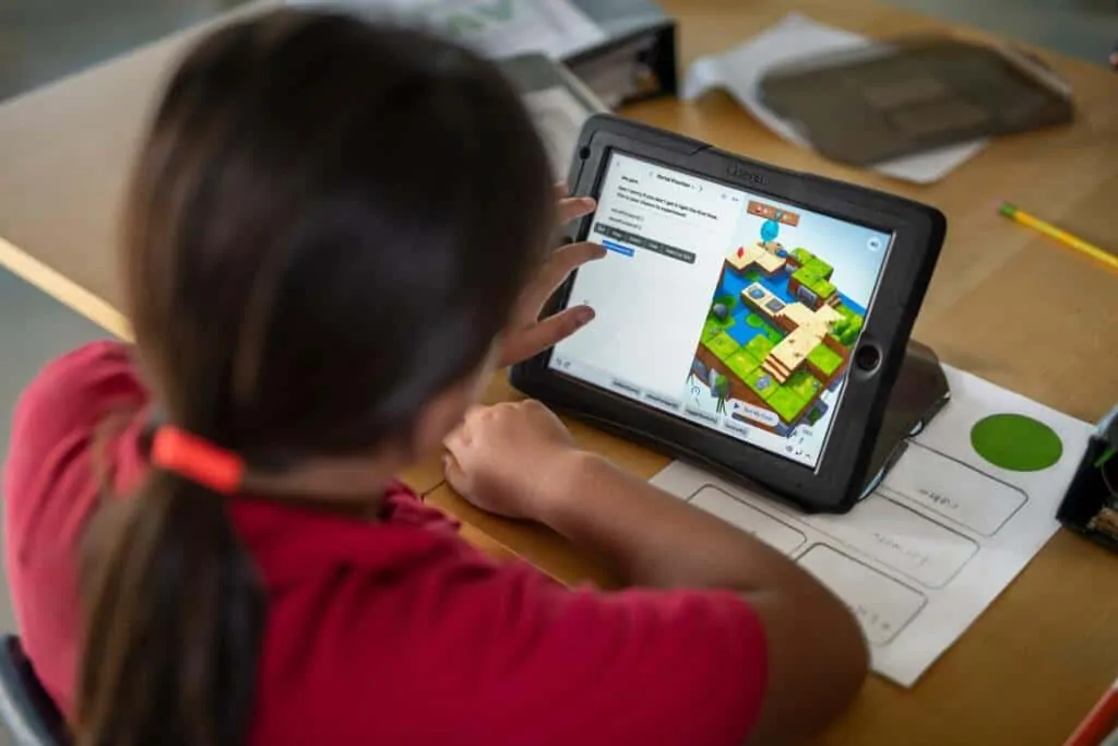 A child learning to code with Swift Playgrounds on the iPad